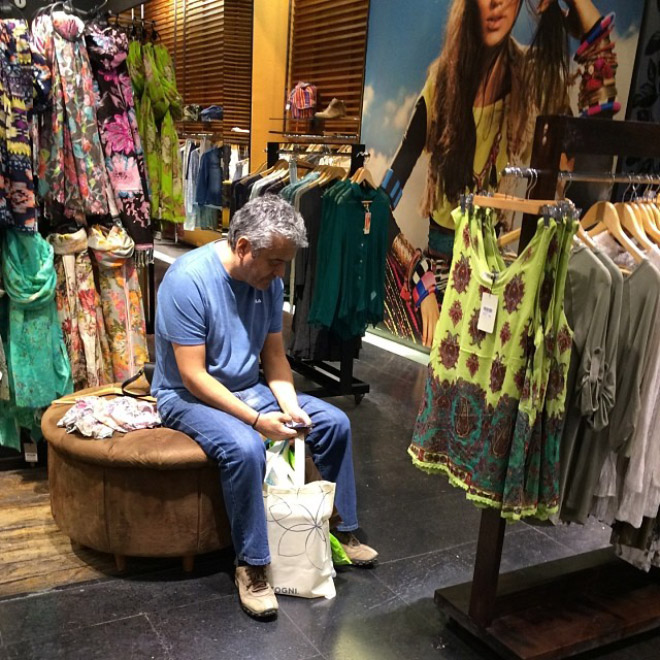 Miserable man trapped in shopping hell.