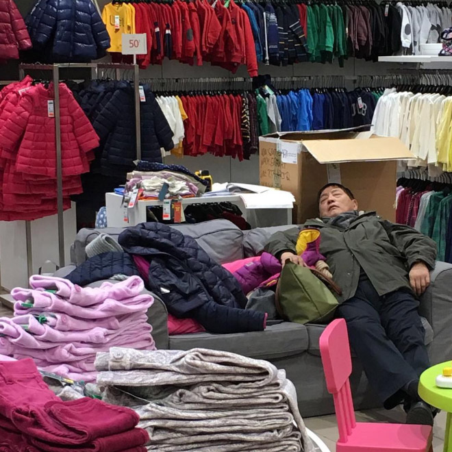 Miserable man trapped in shopping hell.