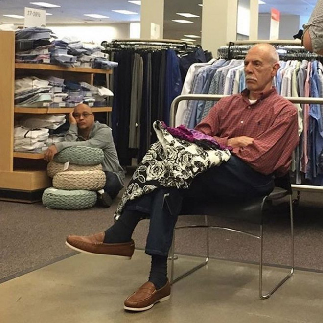 Miserable man trapped in shopping hell.