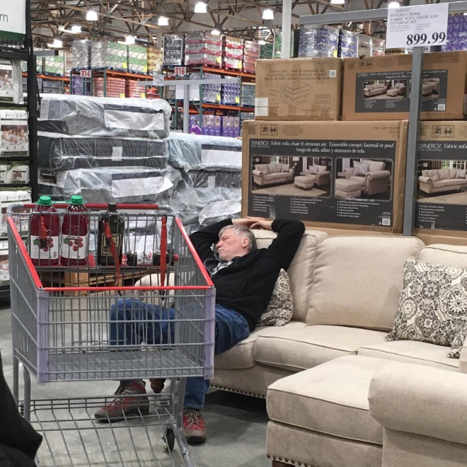 Miserable man trapped in shopping hell.