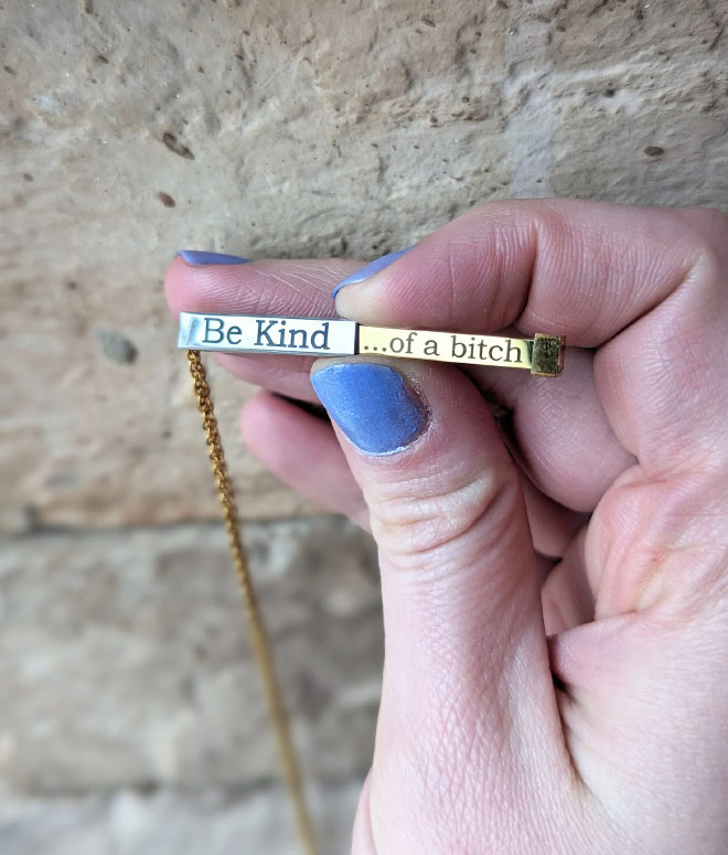 "Be kind... of a bitch" necklace.